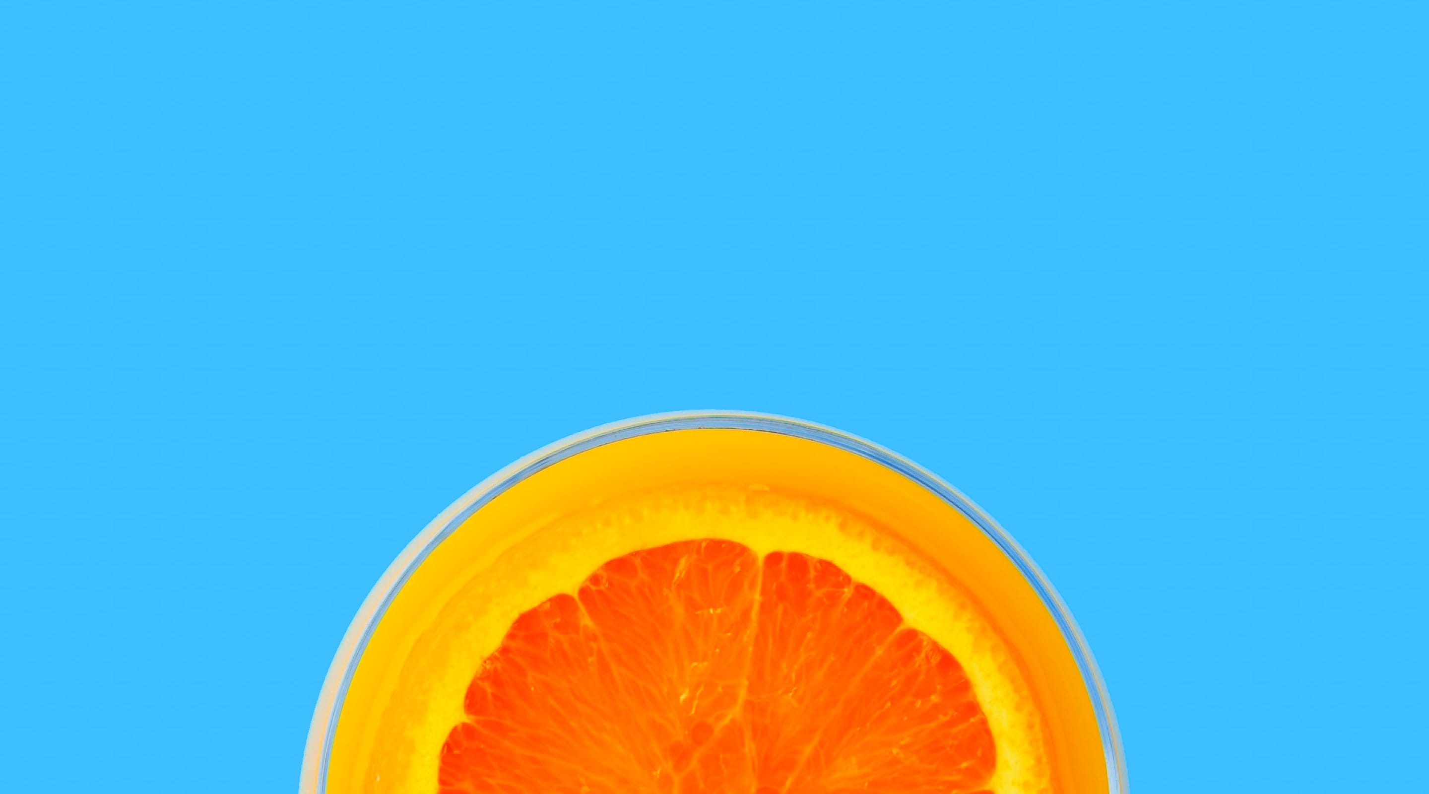 Half cut orange on blue background