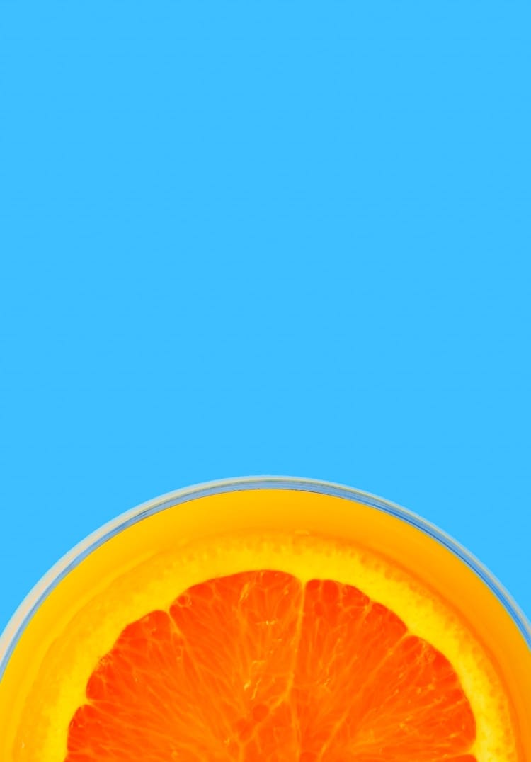 Half cut orange on blue background